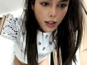 Gorgeous brunette TS shows her gigantic dick on webcam